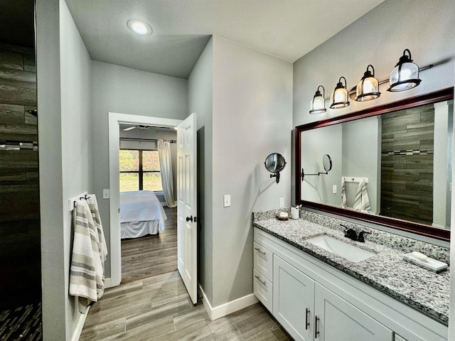 bathroom featuring vanity, curtained shower, and hardwood / wood-style flooring