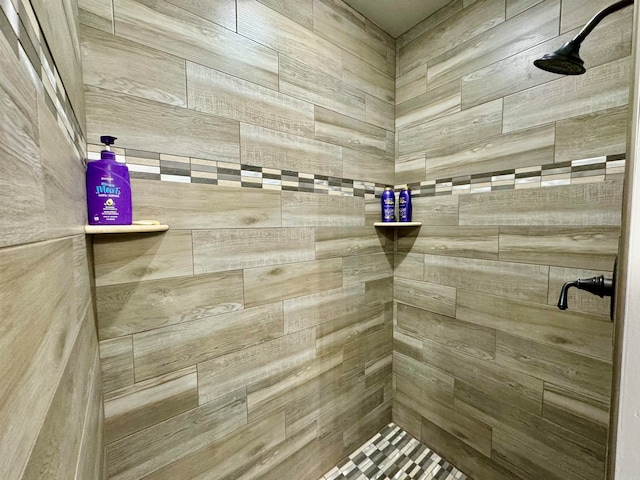 bathroom with a tile shower