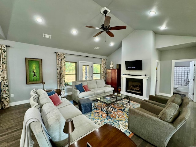 living room with dark hardwood / wood-style floors, high vaulted ceiling, and ceiling fan