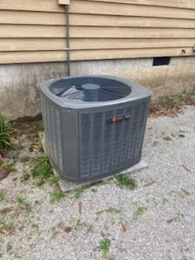 exterior details featuring central air condition unit and crawl space