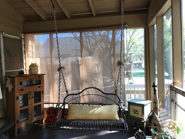 sunroom / solarium with beamed ceiling and a wealth of natural light