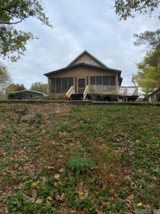 rear view of house with a sunroom