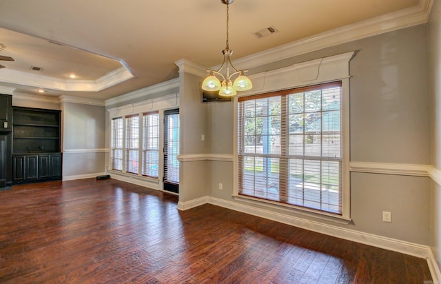 empty room featuring crown molding, ceiling fan with notable chandelier, and dark hardwood / wood-style flooring