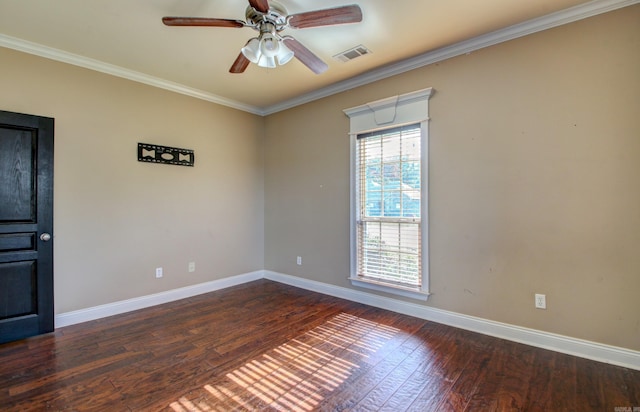 spare room with dark wood-type flooring, ceiling fan, and ornamental molding