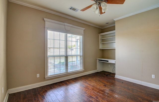 interior space with built in desk, ornamental molding, ceiling fan, and dark hardwood / wood-style flooring