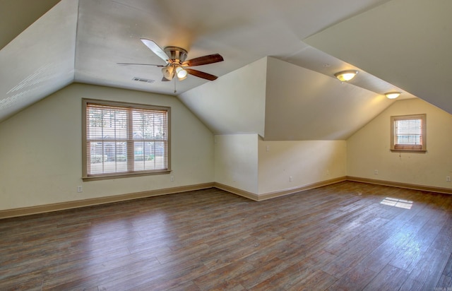 bonus room with a wealth of natural light, lofted ceiling, hardwood / wood-style floors, and ceiling fan