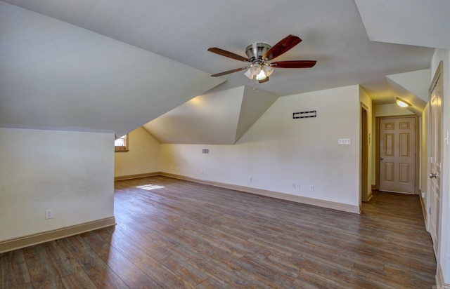 additional living space featuring ceiling fan, vaulted ceiling, and dark hardwood / wood-style flooring