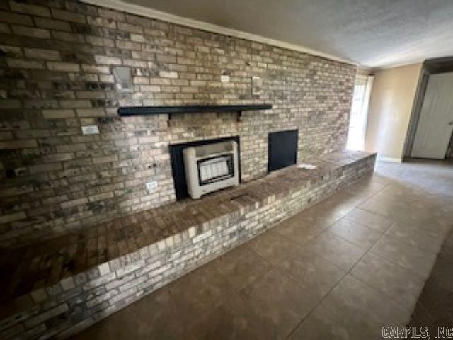 unfurnished living room featuring ornamental molding