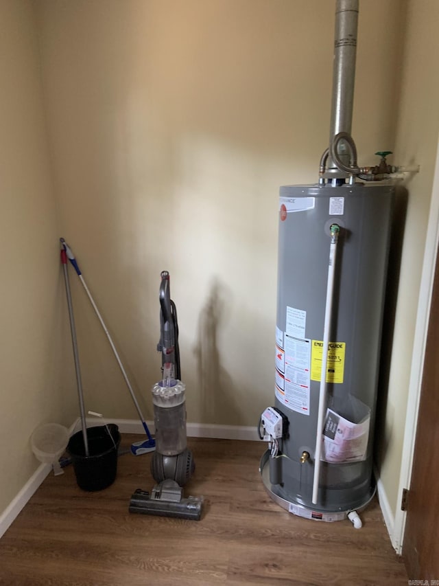 utility room featuring water heater