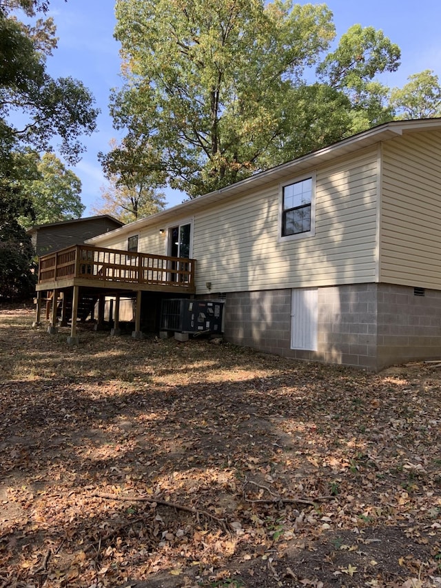 back of property featuring a deck