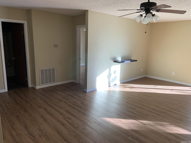 unfurnished room featuring wood-type flooring, a textured ceiling, and ceiling fan