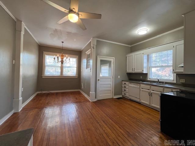 919 E Hamilton Ave, Wynne, AR 72396 - kitchen featuring white dishwasher, dark countertops, ornamental molding, and a healthy amount of sunlight