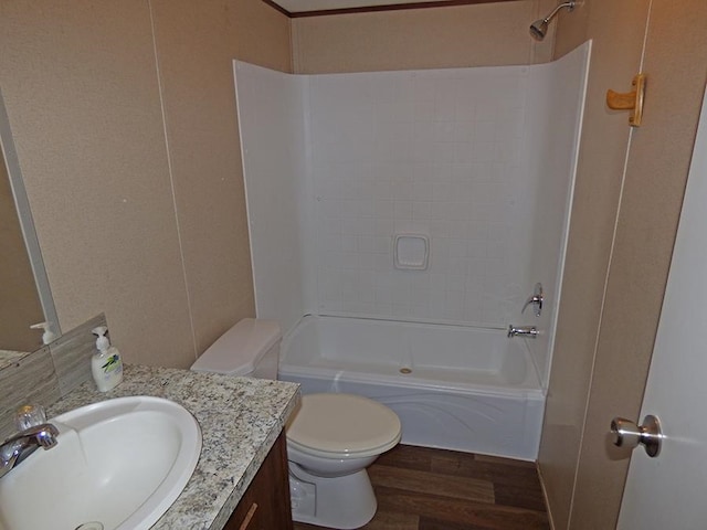 full bathroom featuring vanity, shower / bathing tub combination, wood-type flooring, and toilet