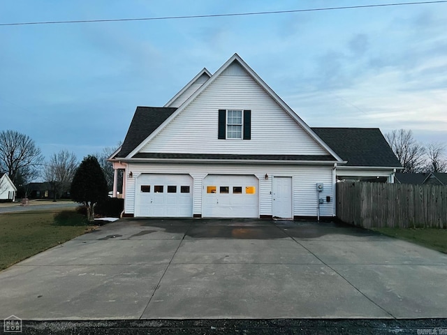 view of side of property featuring a garage