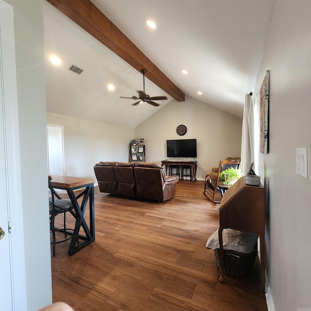 living room with lofted ceiling with beams, hardwood / wood-style flooring, and ceiling fan