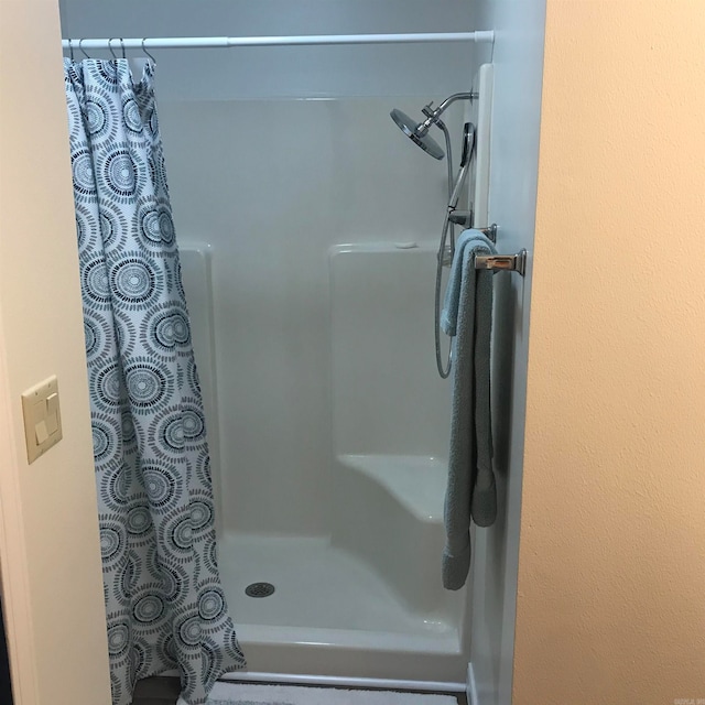 bathroom with a shower with shower curtain