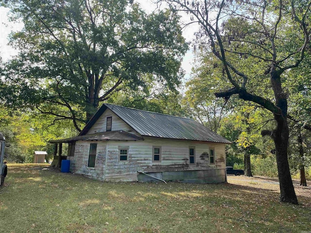 view of home's exterior with a lawn