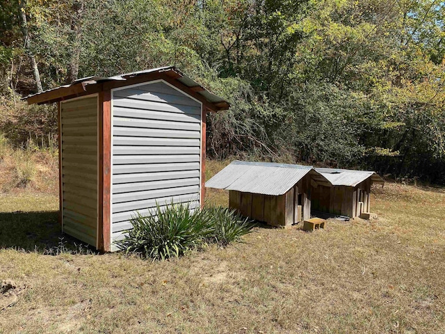 view of outbuilding with a lawn