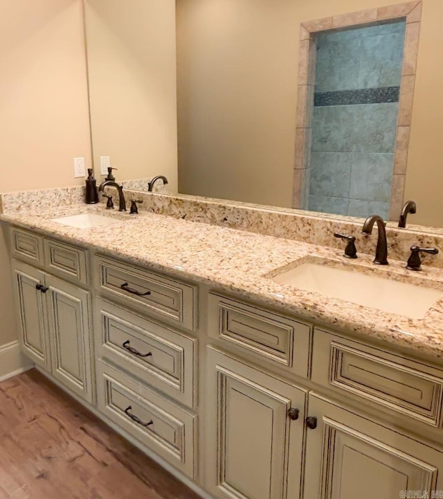 bathroom featuring vanity and hardwood / wood-style floors