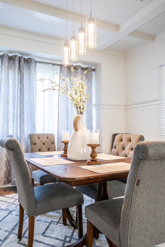 dining room with coffered ceiling, beamed ceiling, and wood-type flooring