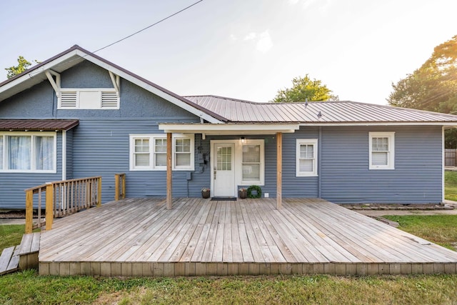 back of house with a wooden deck