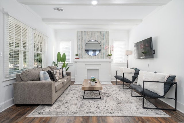 living room with ornamental molding, beam ceiling, and dark hardwood / wood-style flooring