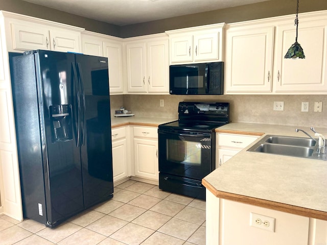 kitchen with black appliances, white cabinetry, pendant lighting, sink, and decorative backsplash