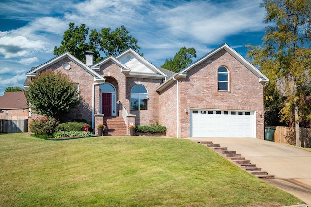 front of property with a garage and a front lawn