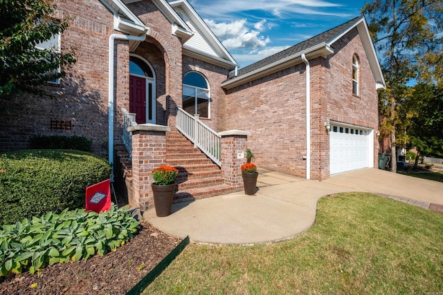 view of front of property with a front lawn and a garage