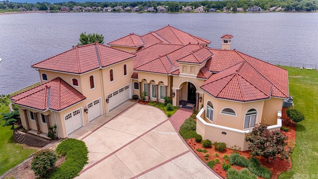 birds eye view of property with a water view