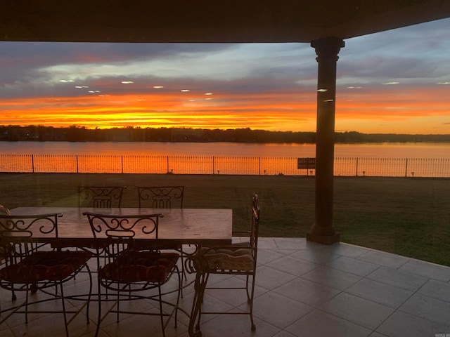 patio terrace at dusk with a water view