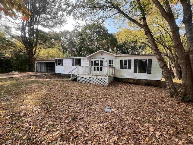 view of front of property featuring a wooden deck