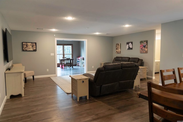 living room featuring dark wood-type flooring