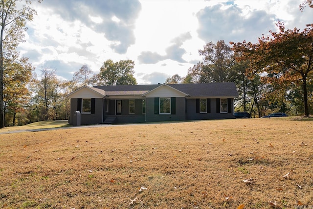 ranch-style home featuring a front yard