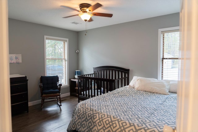 bedroom featuring ceiling fan and dark hardwood / wood-style flooring