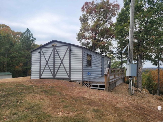 view of outdoor structure featuring a lawn