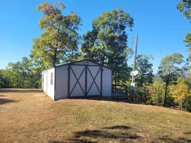 view of outdoor structure with a lawn