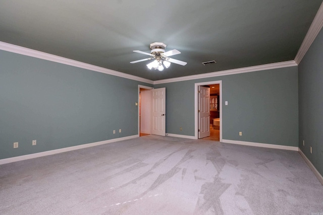 unfurnished bedroom with ceiling fan, crown molding, ensuite bathroom, and light colored carpet