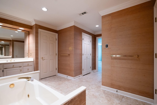 bathroom with vanity, a tub, and ornamental molding