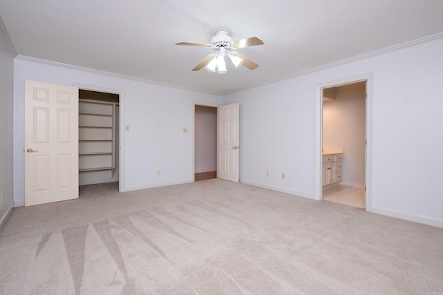 unfurnished bedroom featuring connected bathroom, ceiling fan, ornamental molding, and light colored carpet