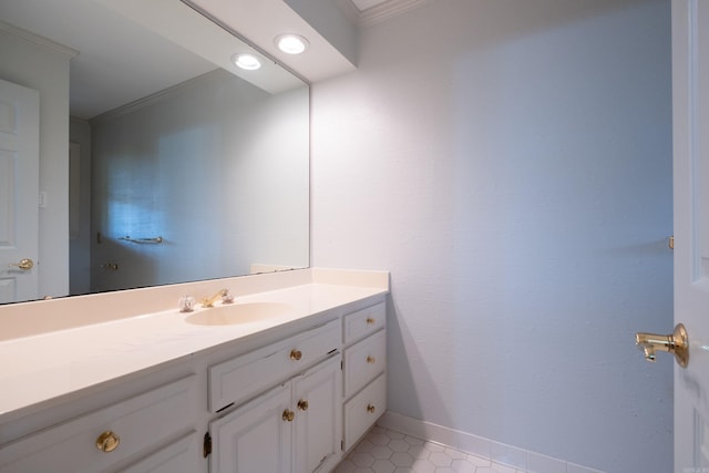 bathroom with vanity, crown molding, and tile patterned floors