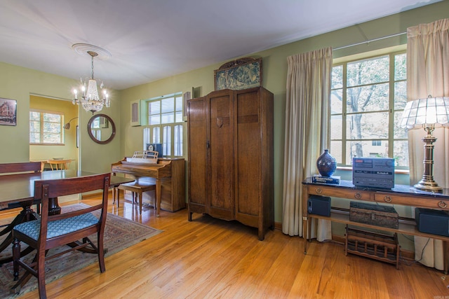 dining space featuring a wealth of natural light and light wood-type flooring