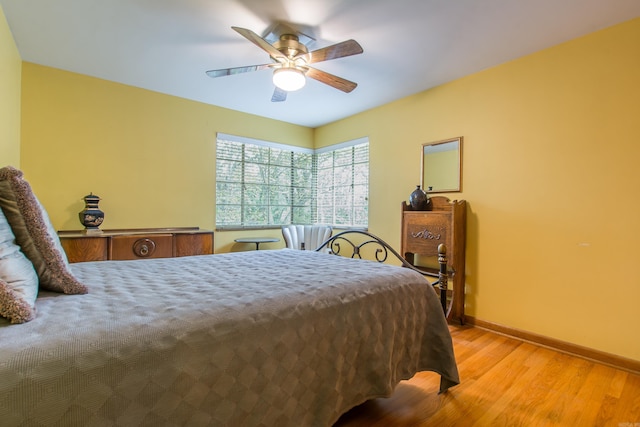 bedroom featuring ceiling fan and light hardwood / wood-style flooring