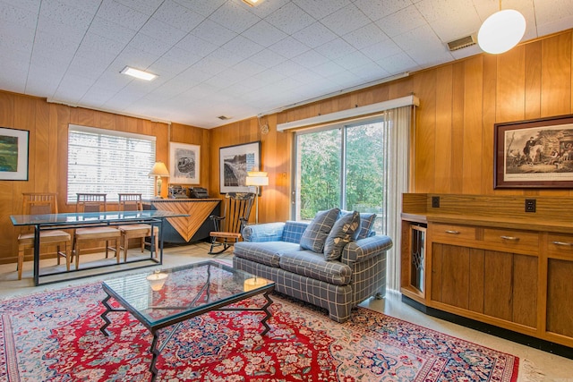 living room featuring wood walls