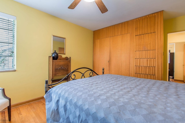 bedroom featuring ceiling fan and light hardwood / wood-style flooring