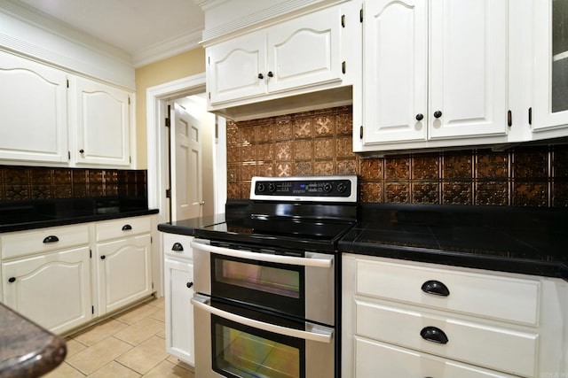 301 Reine St, Mena, AR 71953 - kitchen with double oven range, crown molding, tasteful backsplash, white cabinets, and under cabinet range hood