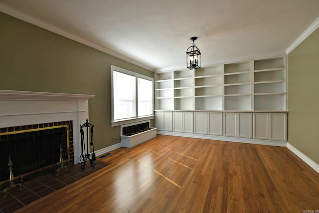 unfurnished living room with an inviting chandelier, ornamental molding, and wood-type flooring