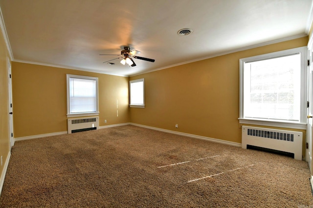 carpeted spare room featuring ornamental molding, radiator heating unit, and ceiling fan