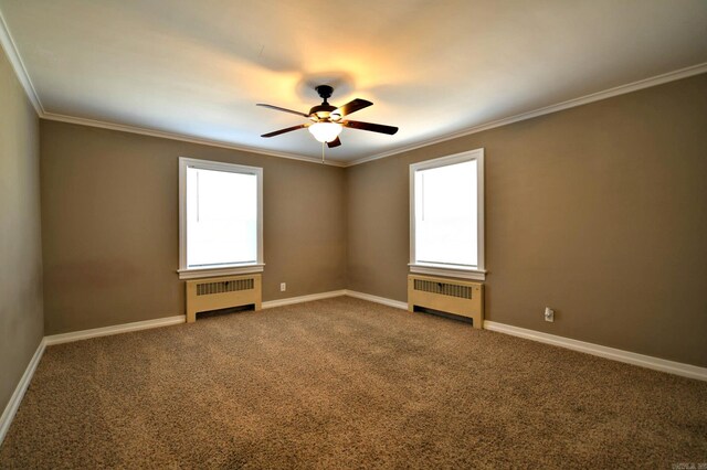 empty room with a healthy amount of sunlight, radiator, and carpet