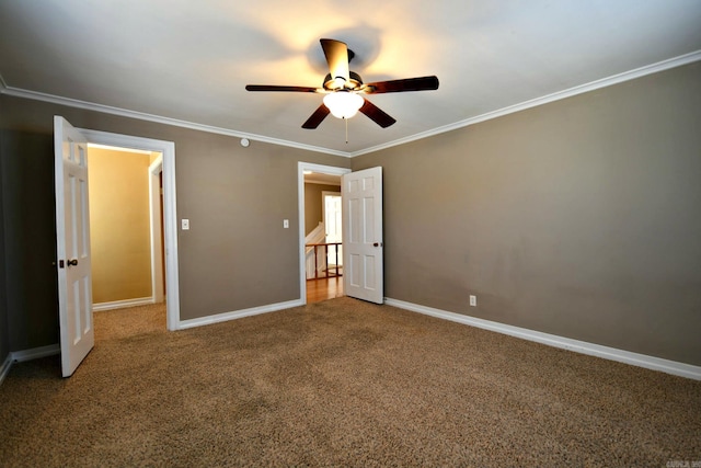 unfurnished bedroom with ceiling fan, carpet flooring, and ornamental molding